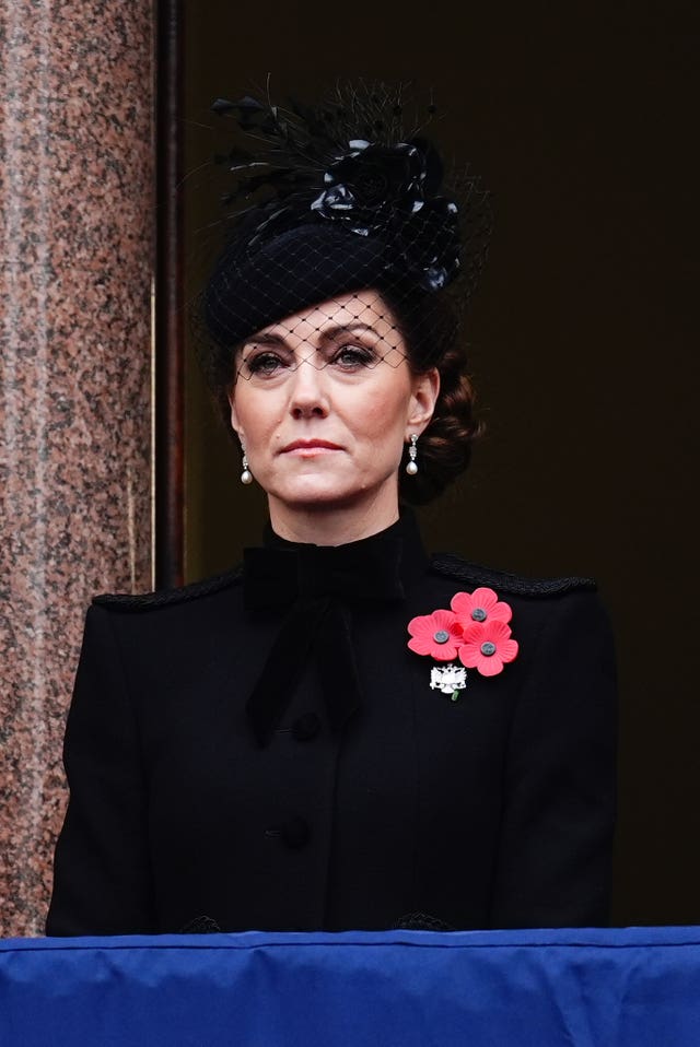 Princess of Wales in black wearing poppies