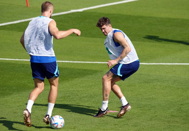 Eric Dier up against John Stones during an England training session
