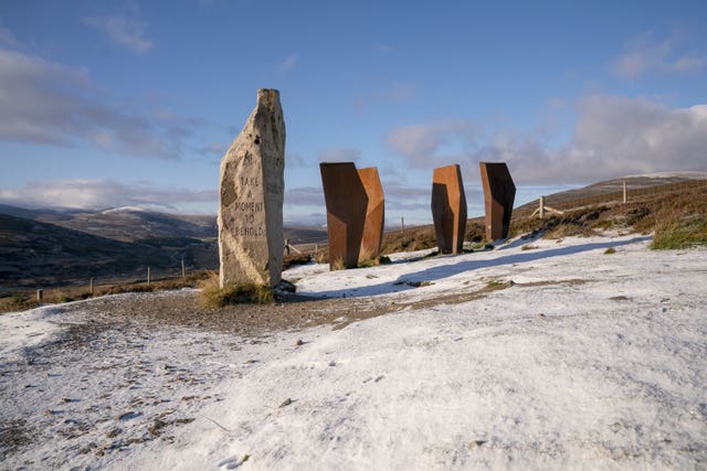 Snow surrounding Watchers sculpture in Corgaff