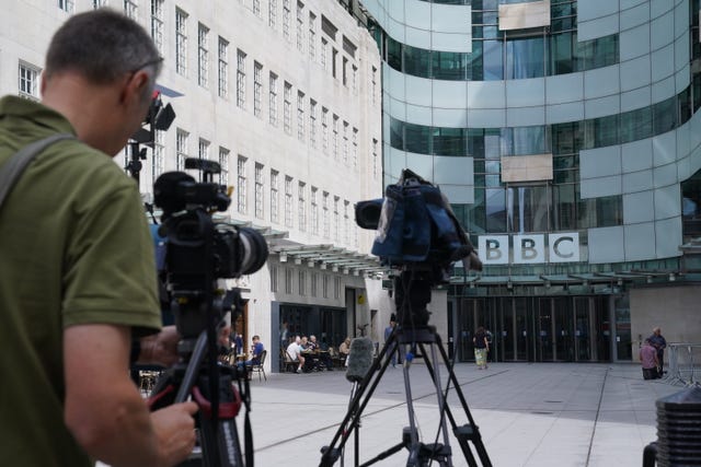 Members of the media gather outside BBC Broadcasting House in central London