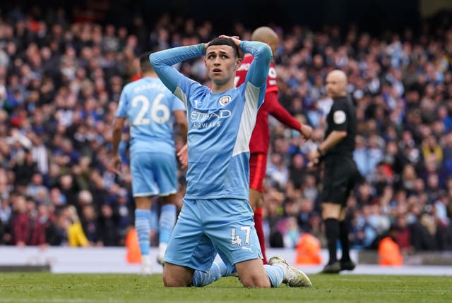 Manchester City’s Phil Foden shows his frustration after Riyad Mahrez missed a late chance against Liverpool