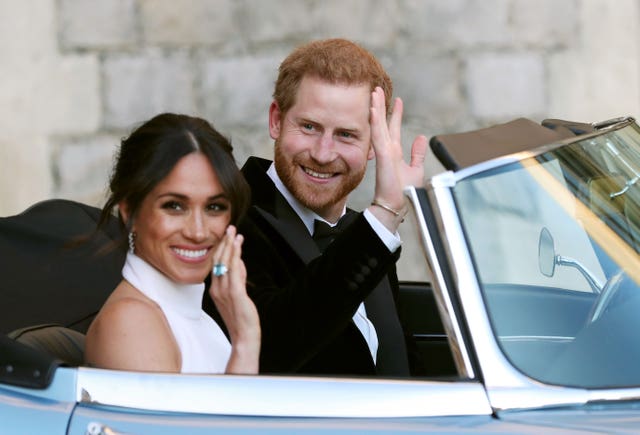 The newly married Duke and Duchess of Sussex, Meghan Markle and Prince Harry, leaving Windsor Castle after their wedding to attend an evening reception at Frogmore House, hosted by the Prince of Wales (Steve Parsons/PA)