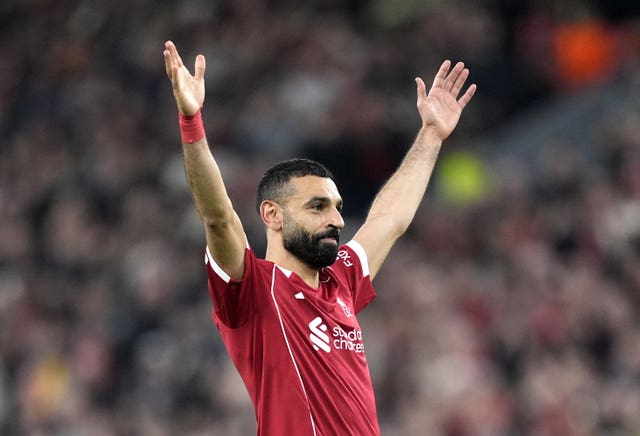 Mohamed Salah raises his arms