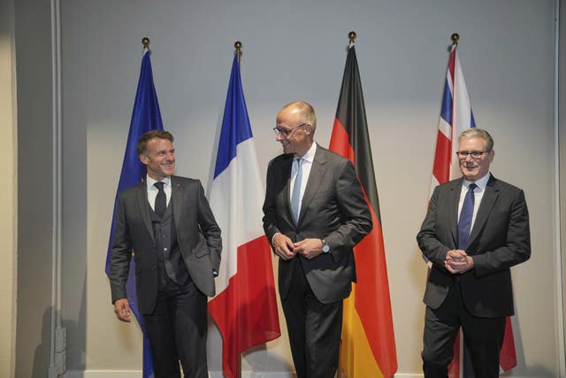 French President Emmanuel Macron, Germany’s Chancellor Friedrich Merz and Prime Minister Sir Keir Starmer on the sidelines of the Nato summit in The Hague, in June