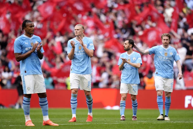 Manchester City players on the pitch at Wembley after losing the 2024 FA Cup final