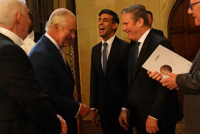 The King speaks with Prime Minister Rishi Sunak and Labour leader Sir Keir Starmer (second right) as Speaker of the House of Commons, Sir Lindsay Hoyle (left) looks on during his visit to Westminster Hall at the Palace of Westminster to attend a reception ahead of the coronation in May 2023