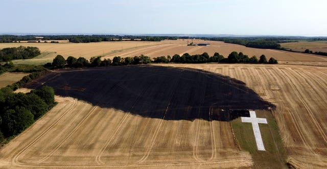 The aftermath of a wildfire in July 2022 that threatened the Lenham Cross war memorial near the village of Lenham in Kent (Gareth Fuller/PA)