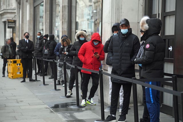 People queueing outside the Nike Town store at Oxford Circus, London (Kirsty O'Connor/PA)