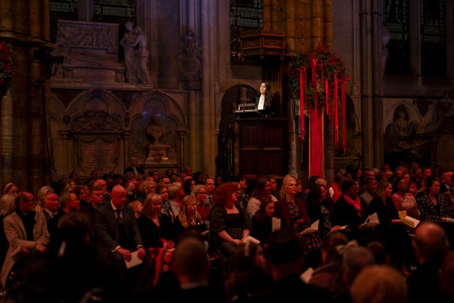 Downton Abbey actress Michelle Dockery surrounded by the congregation 