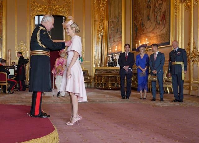 Rachel Riley being made a Member of the Order of the British Empire by the King 