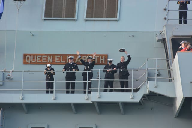 Officers waving to the crowds