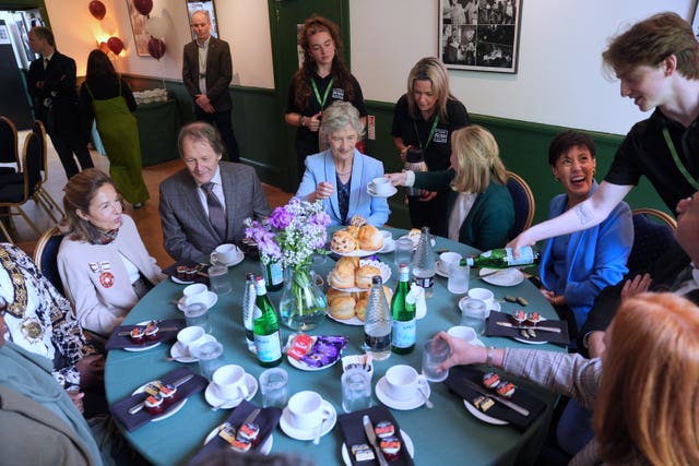 Irish President Catherine Connolly, centre, attends a lunch at the London Irish Centre in Camden, north London