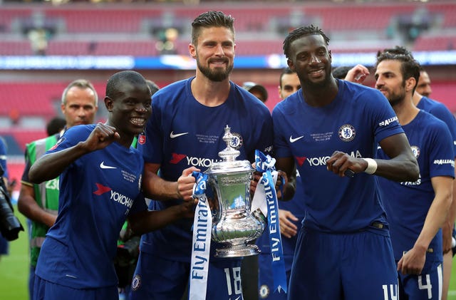 Giroud, centre, and Kante, left, celebrate Chelsea's FA Cup success last season