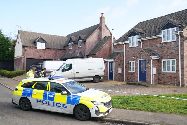 Police at the scene in The Row in Sutton, Cambridgeshire