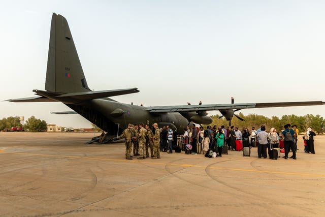 British nationals about to board an RAF aircraft at RAF Akrotiri in Cyprus on Wednesday after being evacuated from Sudan
