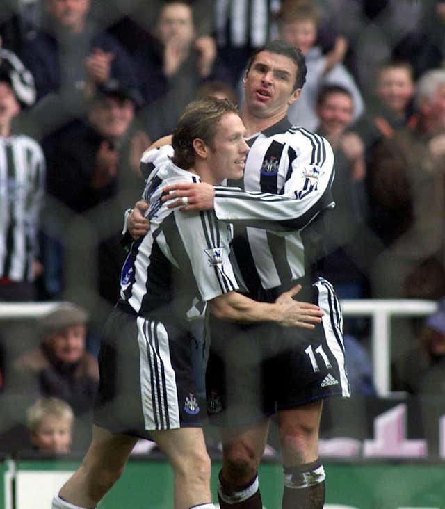 Craig Bellamy celebrates a goal against Everton with Newcastle team-mate Gary Speed