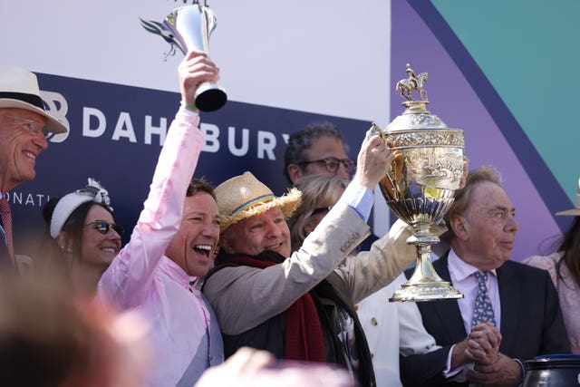 Frankie Dettori celebrates with winning connections