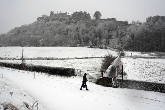 A person walks in the snow at Stirling Castle in Scotland