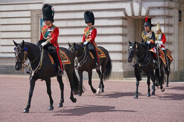 The Prince of Wales (front), the Duke of Cambridge and the Princess Royal leave Buckingham Palace