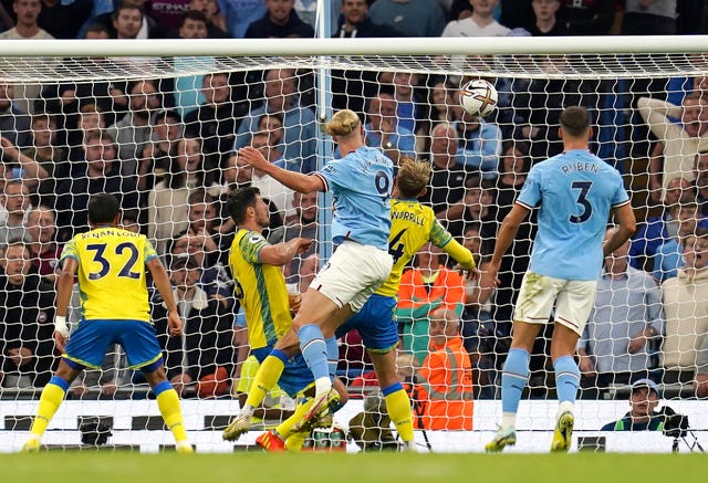 Erling Haaland heads in his third goal of the game