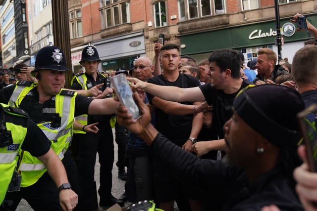 Police face protesters in Nottingham