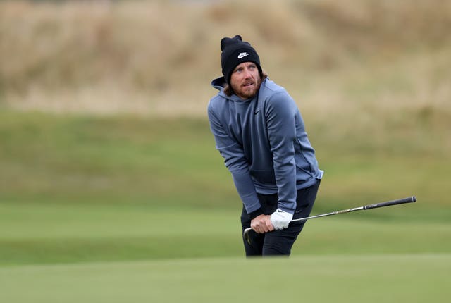 Tommy Fleetwood watches his ball after hitting a shot