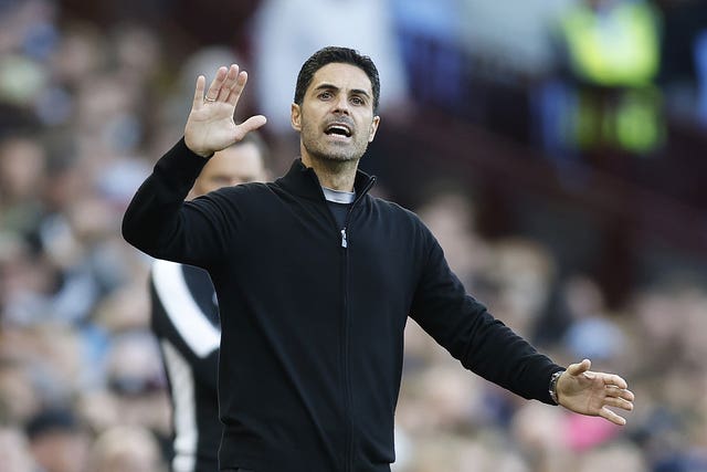 Arsenal boss Mikel Arteta waves on the touchline at Villa Park