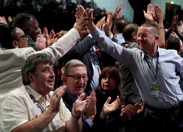 Delegates react during voting on Labour’s Brexit policy