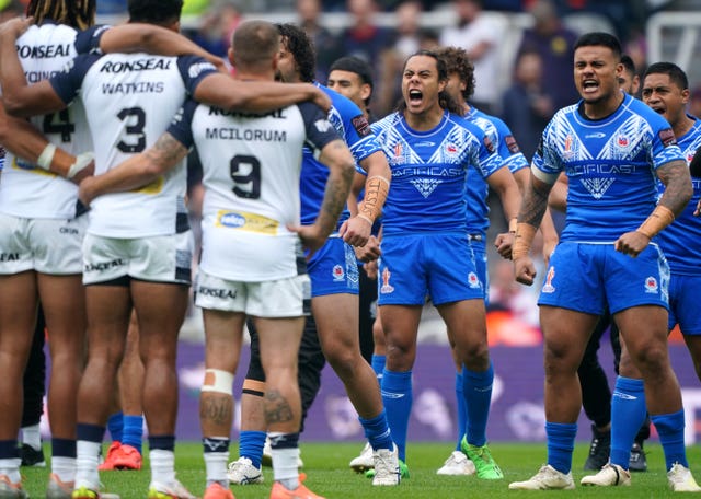 Samoa perform the Siva Tau prior to the game