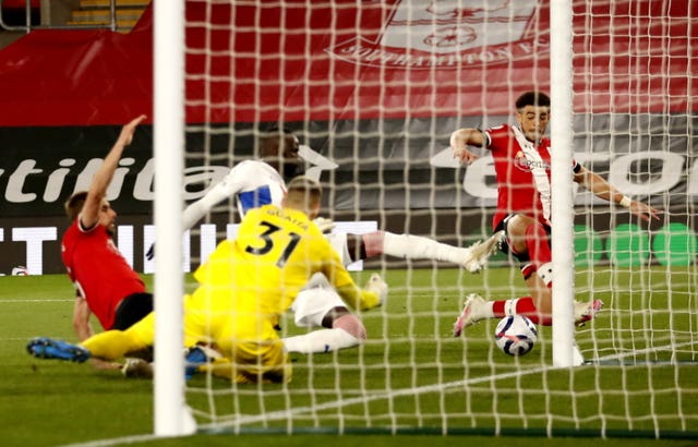 Che Adams, right, scores Southampton’s second goal