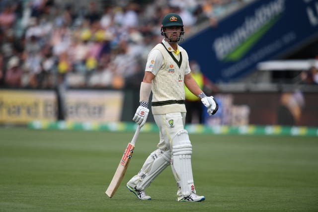 Australia’s Travis Head walks off after losing his wicket