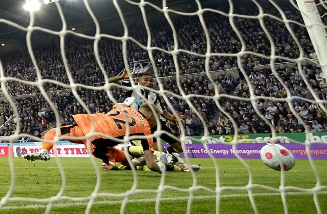 Arsenal’s Ben White turns the ball into his own net for the opening goal at Newcastle