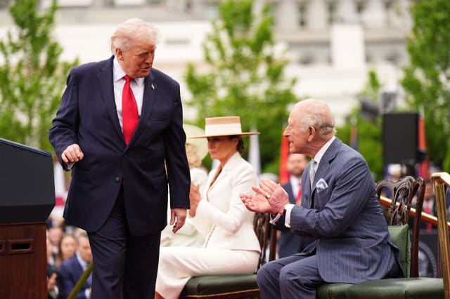 King clapping with Donald Trump