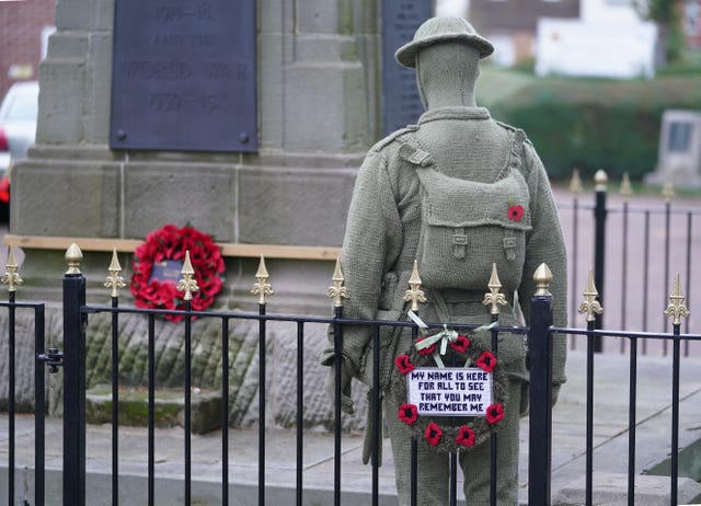 A life-sized knitted soldier