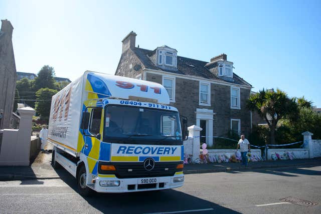 A recovery vehicle at a house on Ardbeg Raod, Bute