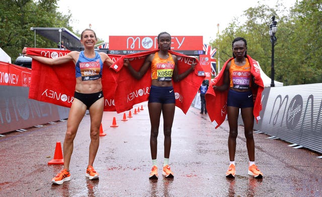 Kenya’s Brigid Kosgei (centre) celebrates winning the elite women’s race alongside second-placed USA’s Sara Hall (left) and Kenya’s Ruth Chepngetich in third 