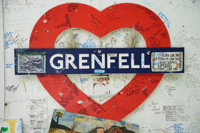 The hoarding around Grenfell Tower