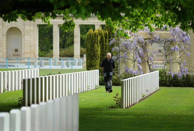 Myles Hunt, Gardener Caretaker 1st Class, walks through the cemetery ahead of the 70th anniversary of D-Day (Gareth Fuller/PA)