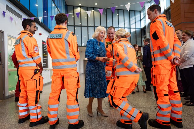 The Queen meets members of the Air Ambulance during a visit to the Royal London Hospital