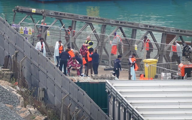 A group of people thought to be migrants being brought in to Dover from a Border Force vessel