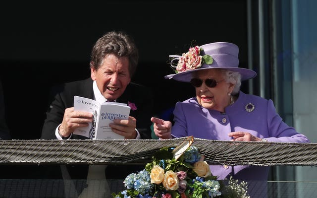 The Queen was in attendance with racing manager John Warren