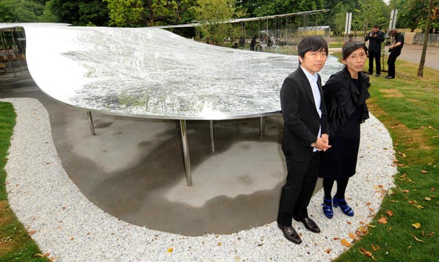 The Serpentine Gallery Pavilion designers Ryue Nishizawa and Kazuyo Sejima standing beside their creation