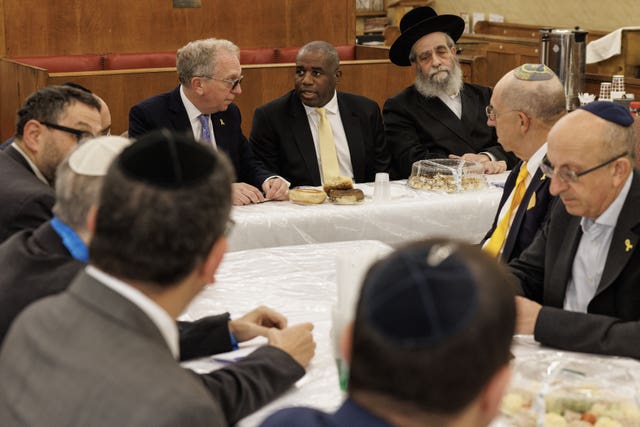 David Lammy sitting at a table with Jewish community members