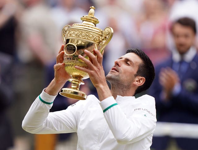 Novak Djokovic lifts the Wimbledon title