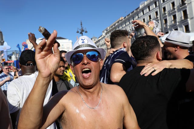 Tottenham supporters enjoy the fan zone in Plaza del Sol