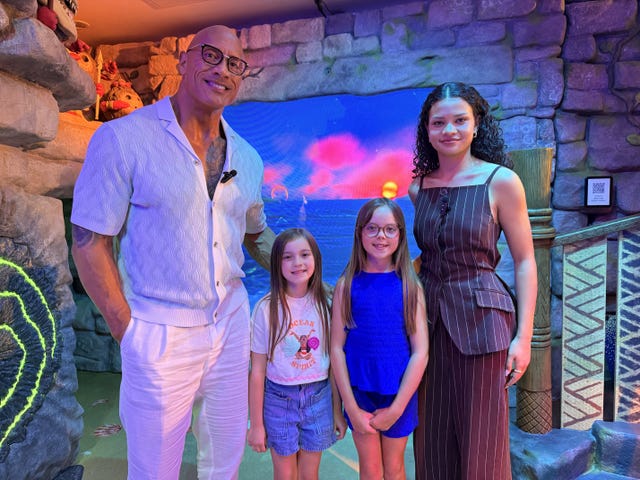 Dwayne Johnson and Catherine Laga’aia, with Bella Riding and her sister Luna