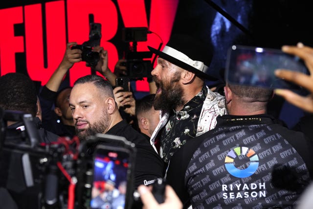 Tyson Fury (centre) threw insults at Oleksandr Usyk towards the end of the face off