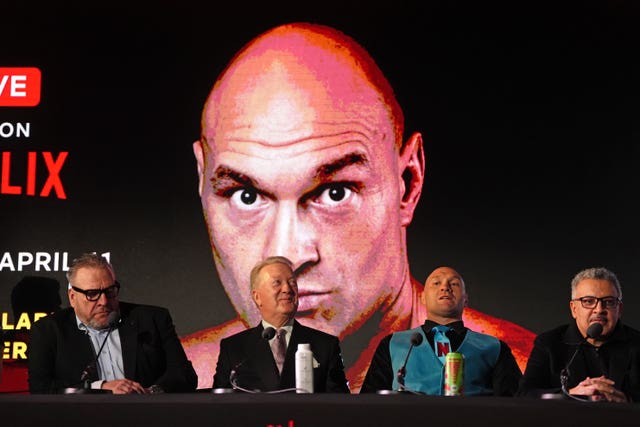 Spencer Brown, left, Frank Warren, second left, and Tyson Fury, second right, during a press conference