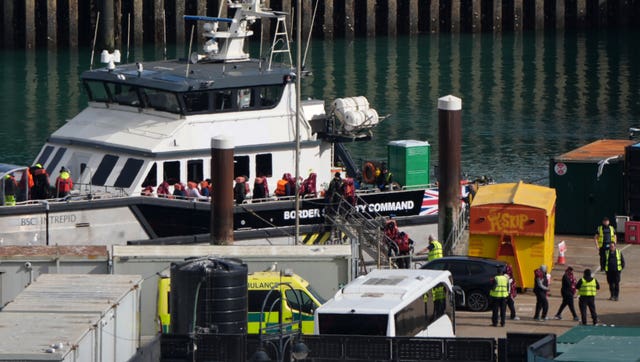 A group of people thought to be migrants are brought in to the Border Force compound in Dover, Kent, from a Border Security Command vessel following a small boat incident in the Channel