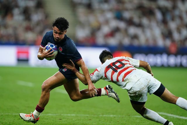 England’s Marcus Smith (left) gets away from Japan’s Rikiya Matsuda 